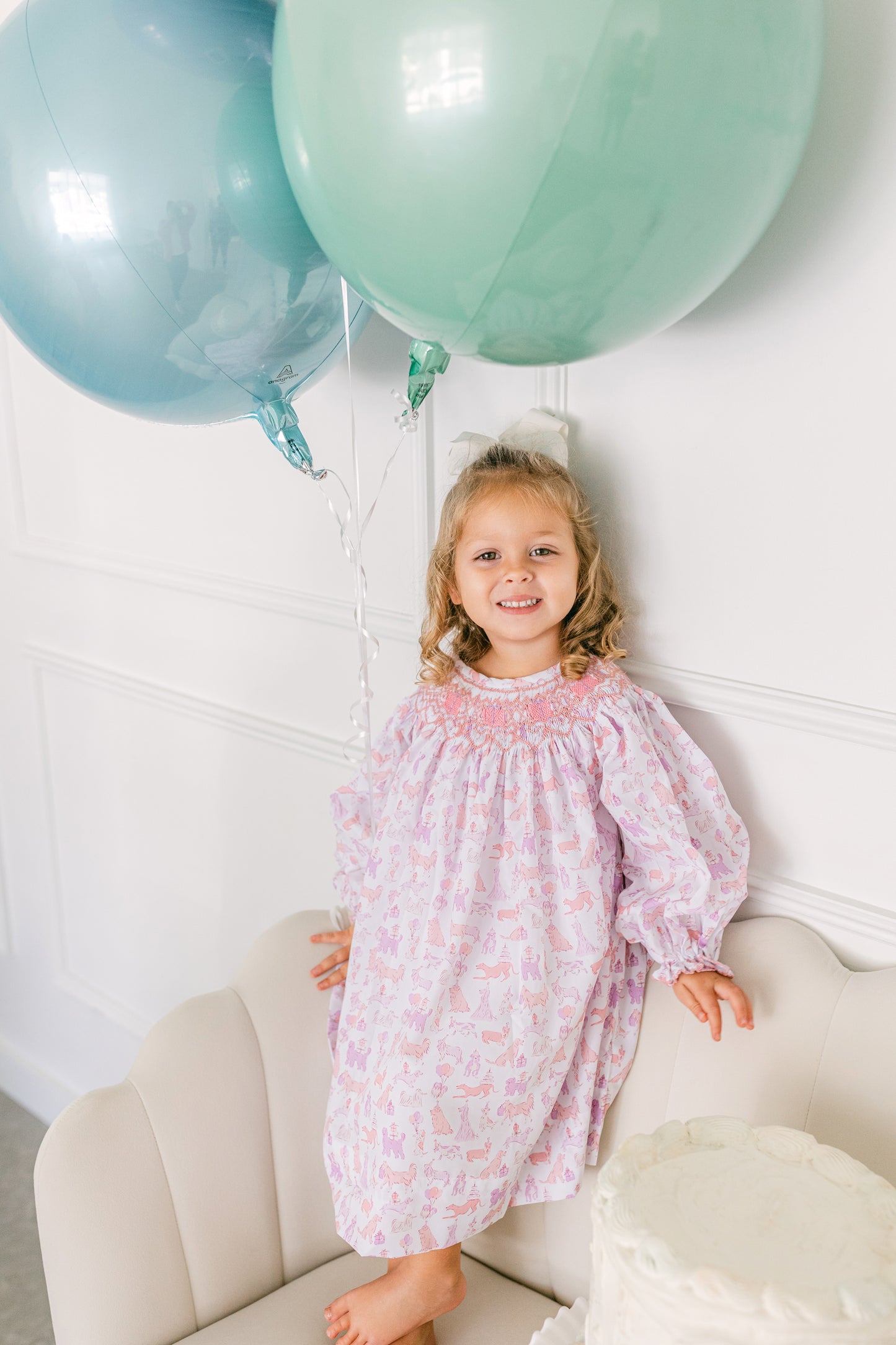 Smocked dress with party puppies