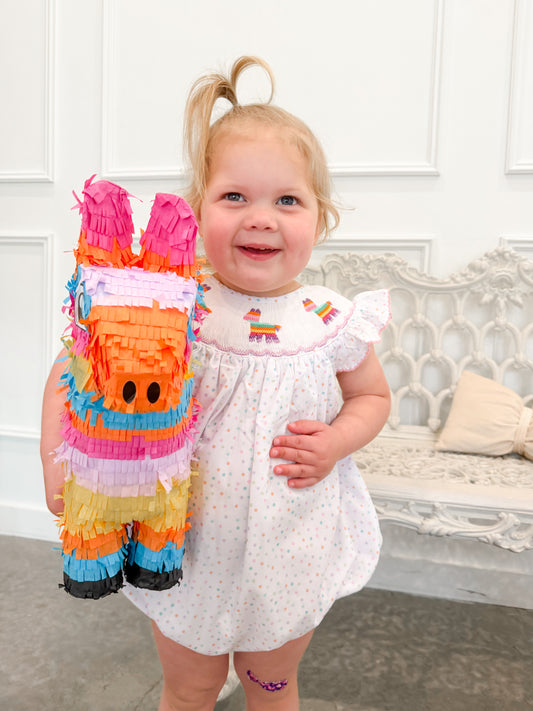 toddler wearing hand smocked pinata bubble