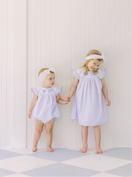Little girls in smocked bubble and dress for Father's Day.