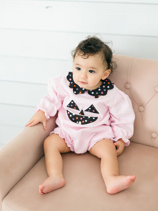 a toddler girl wearing the pink Jack-O-Lantern Bubble