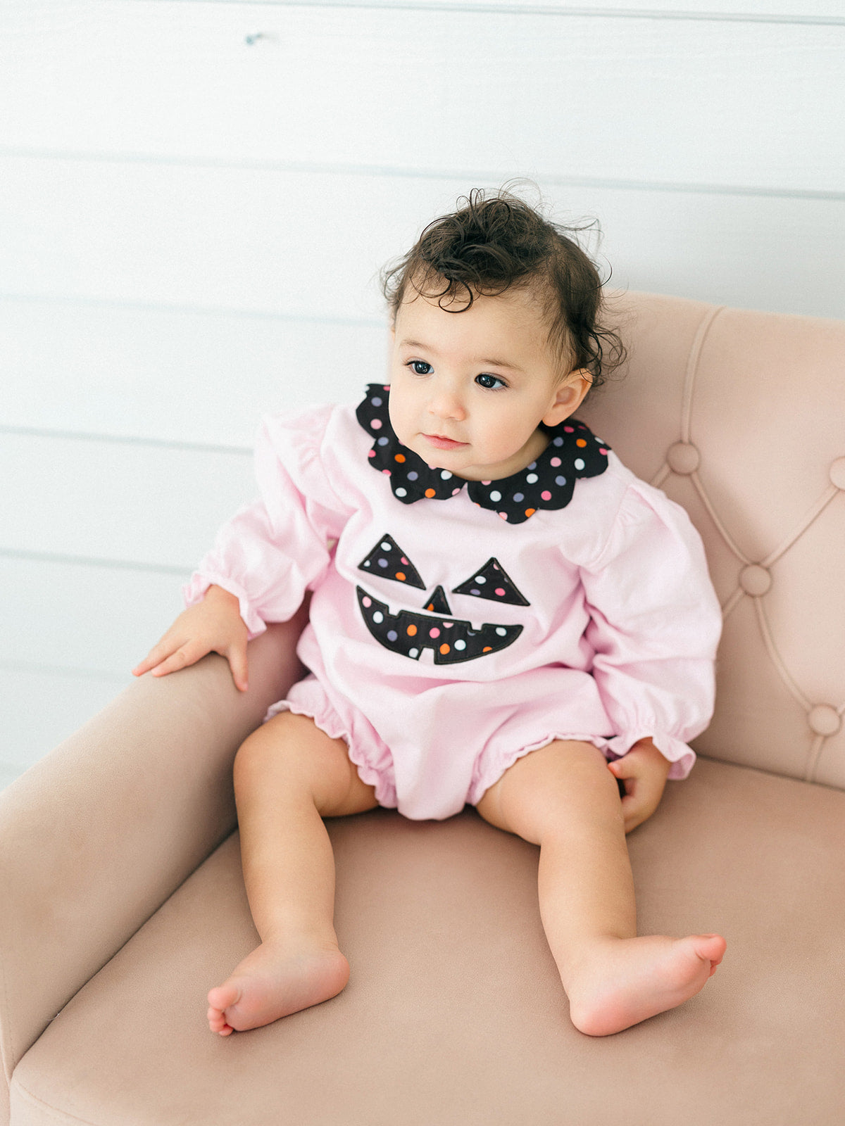 a toddler girl wearing the pink Jack-O-Lantern Bubble