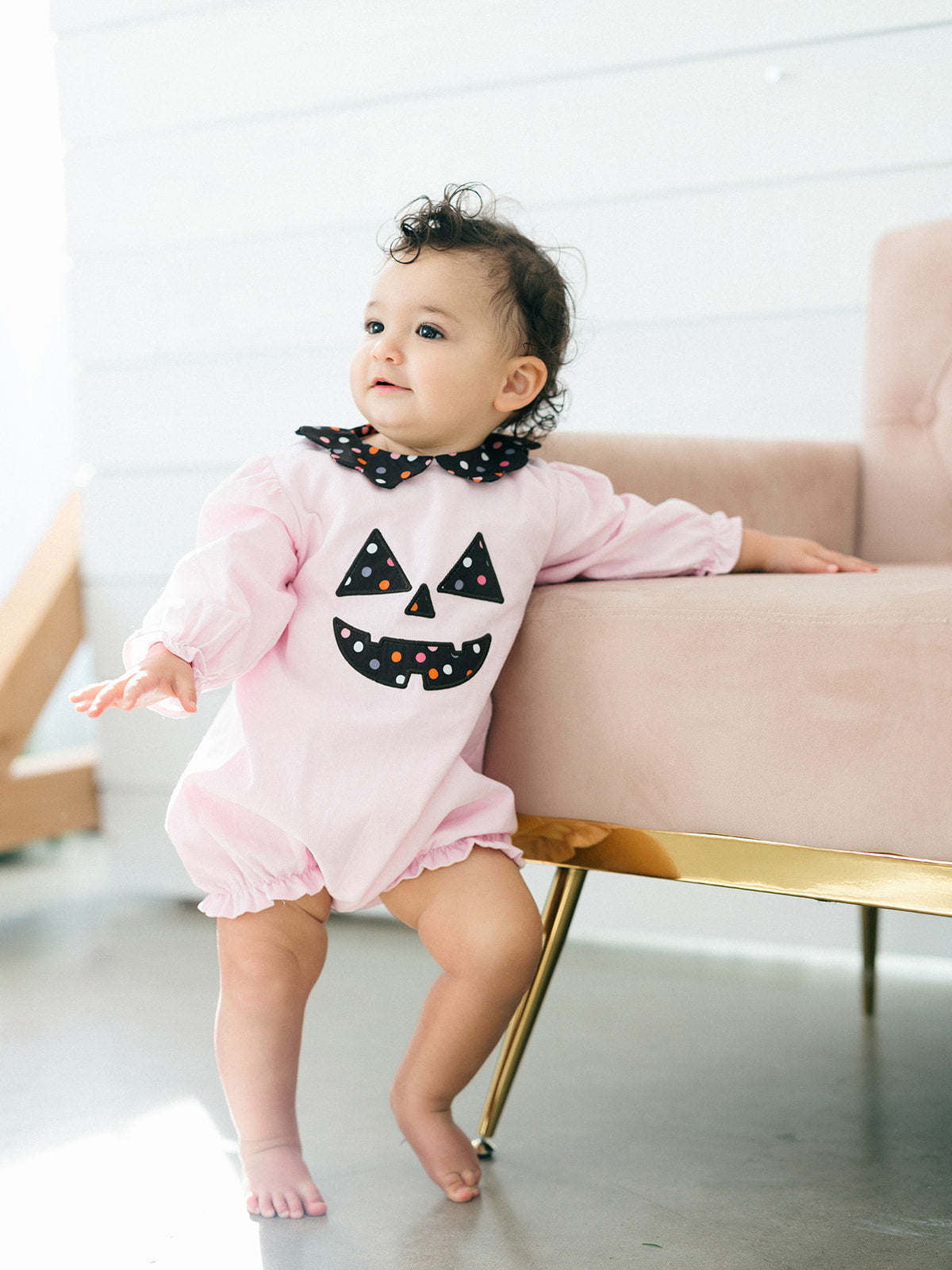 a toddler girl wearing the pink Jack-O-Lantern Bubble