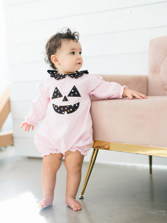 a toddler girl wearing the pink Jack-O-Lantern Bubble