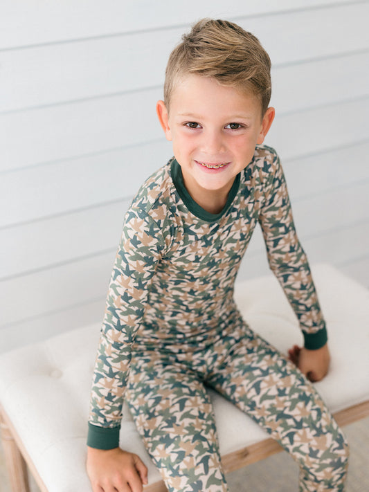 a little boy wearing the perfect bamboo pj set for duck days, fall and hunting