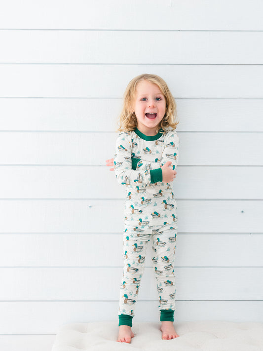 a little boy wearing the duck bamboo pjs for fall and hunting season