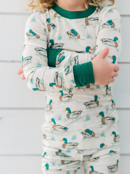 a little boy wearing the duck bamboo pjs for fall and hunting season