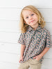 a little boy wearing a camo duck themed polo for duck days, fall and hunting