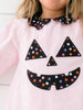 a young girl wearing the pink Jack-O-Lantern Dress 