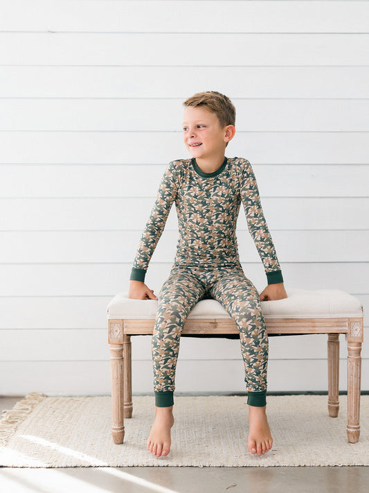 a little boy wearing the perfect bamboo pj set for duck days, fall and hunting