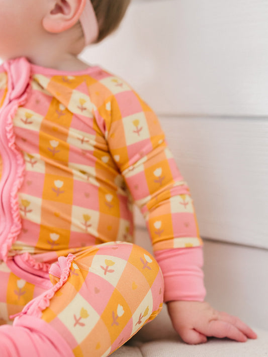 Floral orange bamboo ruffle romper 