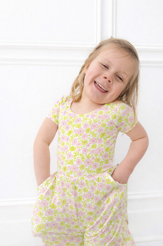 Girl wearing pink and green floral bamboo outfit