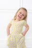 Girl wearing pink and green floral bamboo outfit