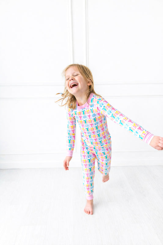 Child wearing a colorful gift pajama on a white background