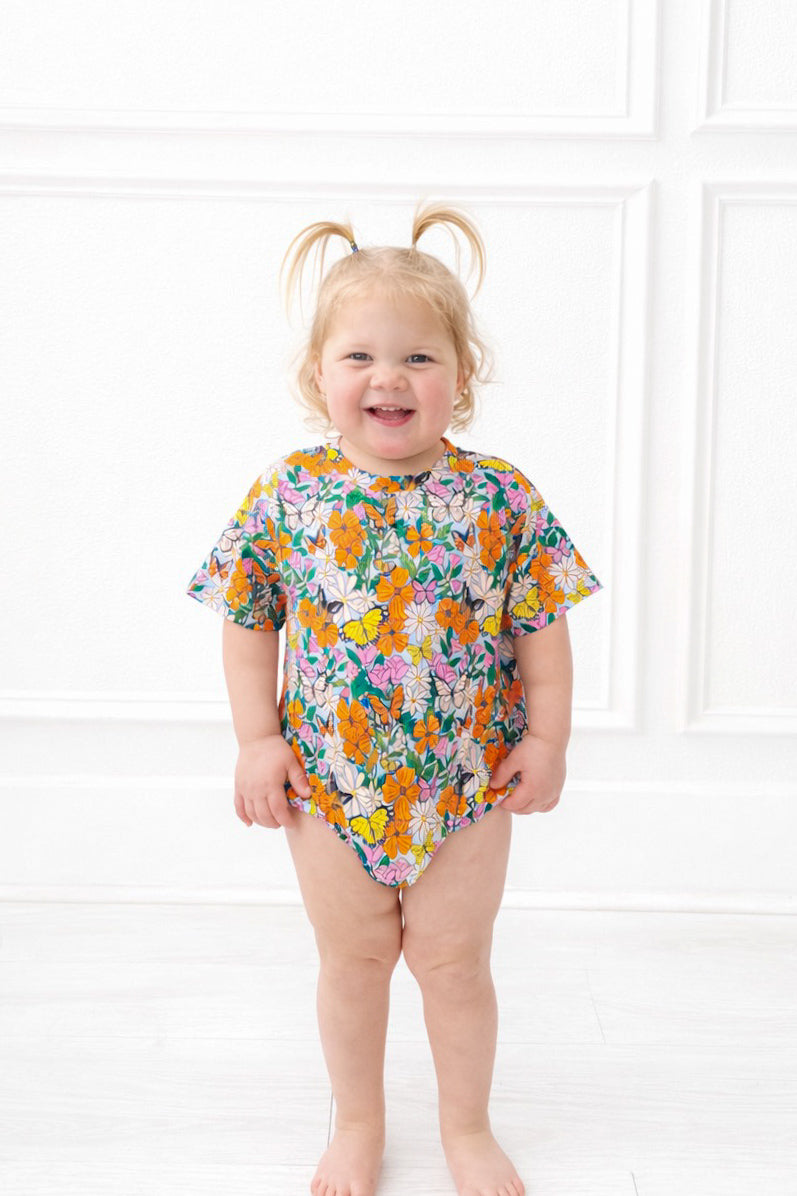 Toddler in pink and orange butterfly bamboo t shirt bubble