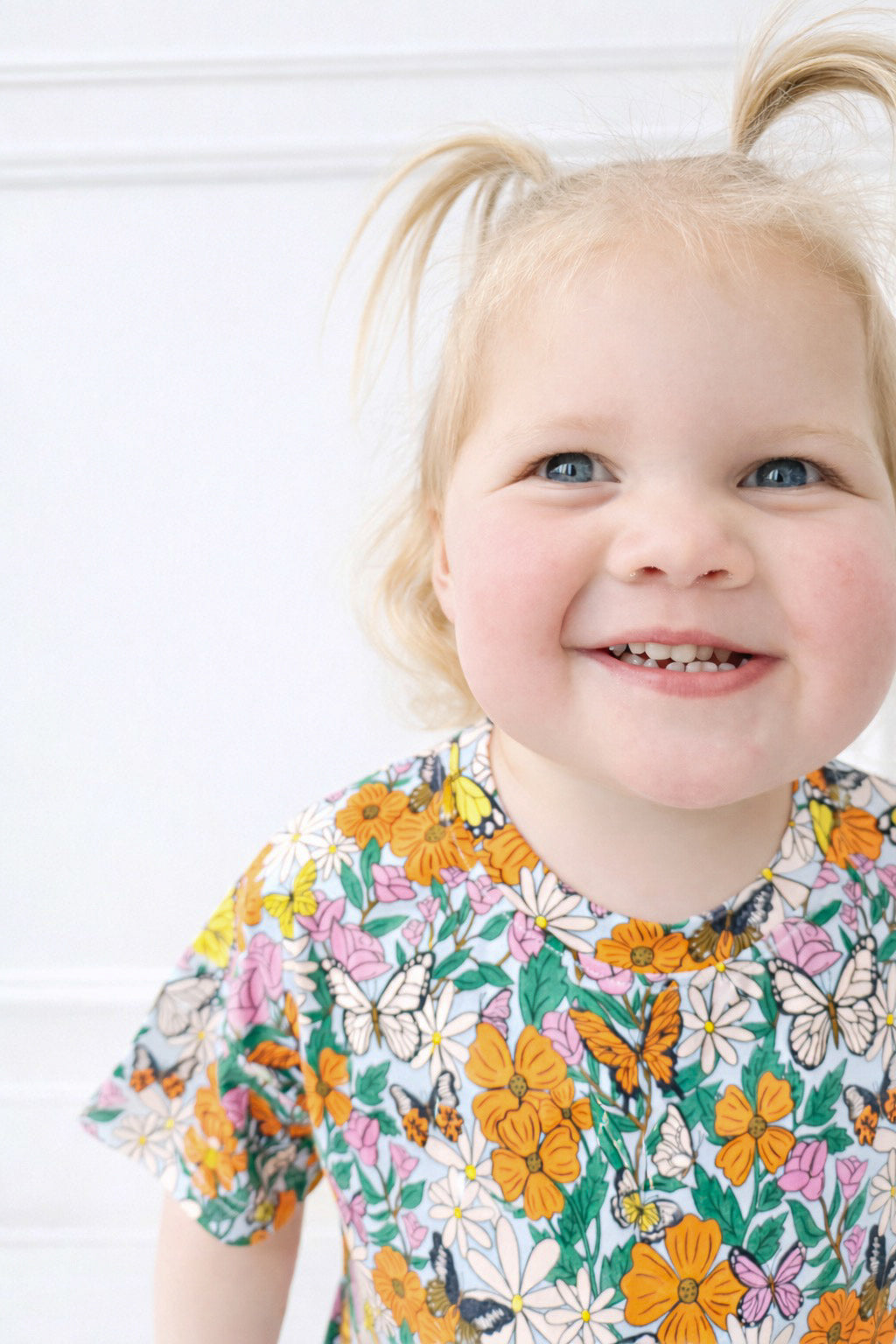 toddler in pink and orange butterfly t shirt bubble