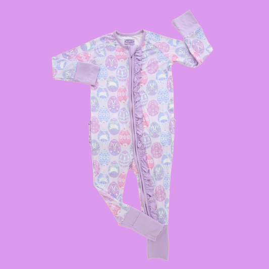 Light purple zip up ruffle pajamas with decorated Easter eggs in various shades of blue, pink and purple