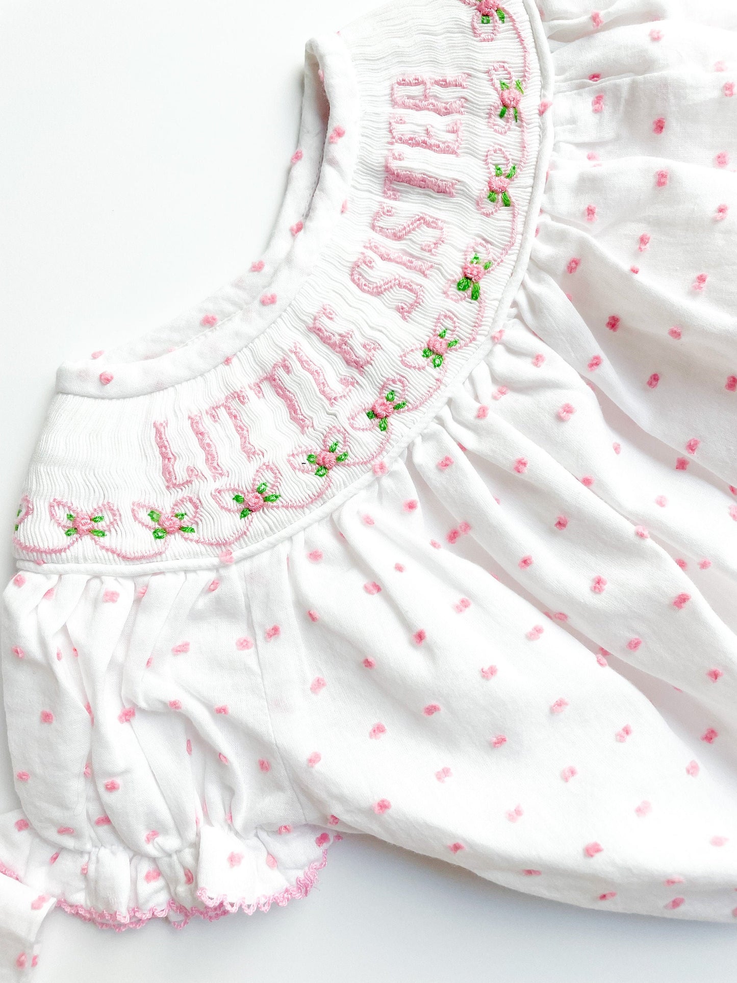 Little sister bubble smocked with pink flowers and pink dots